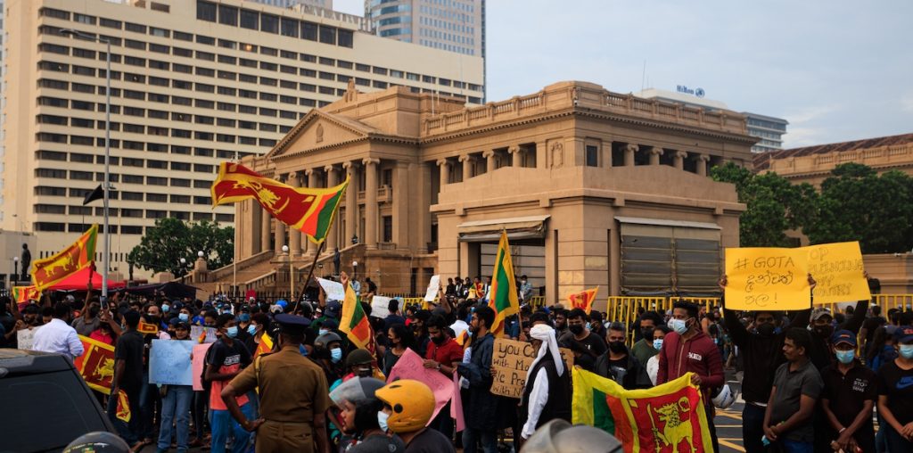 Colombo, Sri Lanka - April 10 2022: People protesting in the streets. Sri Lankaâ€™s President Gotabaya Rajapaksa faces biggest street protest. Sri Lanka economic and politic crisis. Riot police
